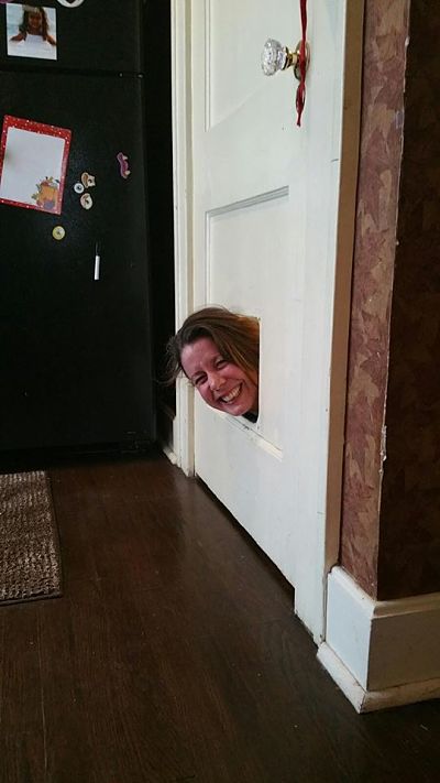 Joie de Vivre - me at my sister's house having some fun with the old cat door (and scaring the crap out of her)